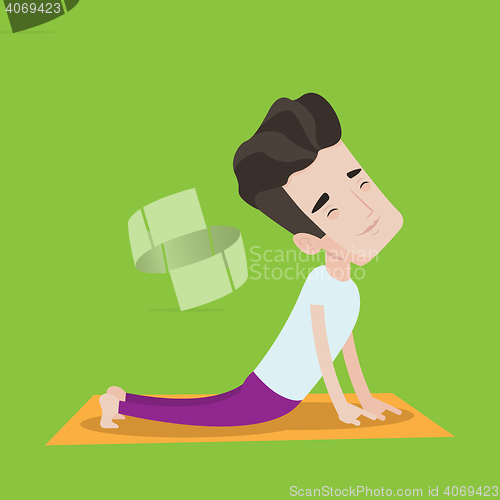Image of Man practicing yoga upward dog pose.
