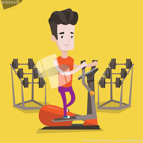 Image of Man exercising on elliptical trainer.