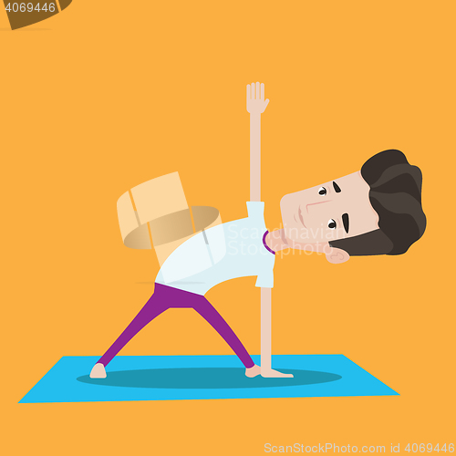 Image of Man practicing yoga triangle pose.