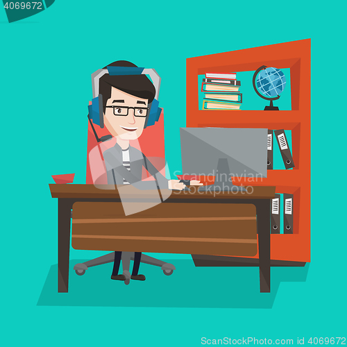 Image of Businessman with headset working at office.