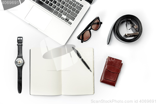 Image of Still life of casual man. Modern male accessories and laptop on white