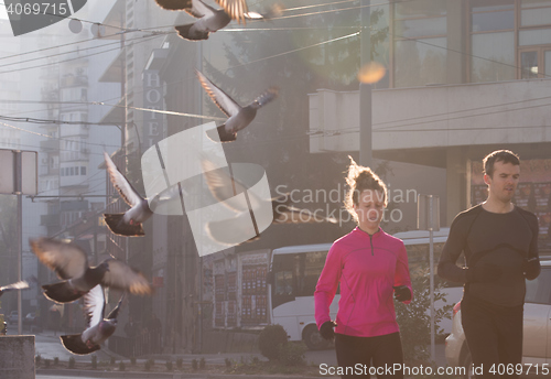 Image of young  couple jogging