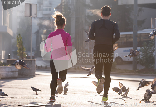 Image of young  couple jogging
