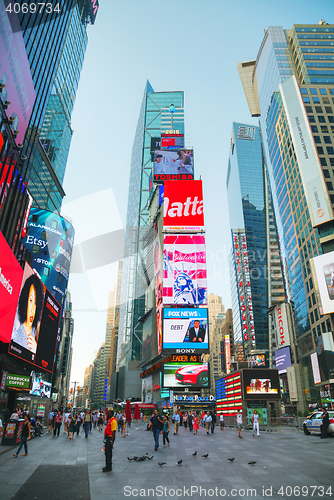 Image of Times square with people in the morning