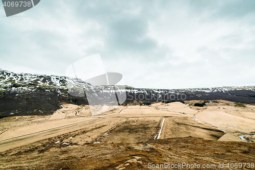 Image of Fields and mountains in cloudy weather