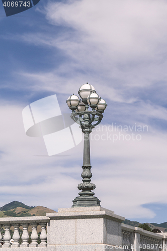 Image of Ancient street lamp with white spheres