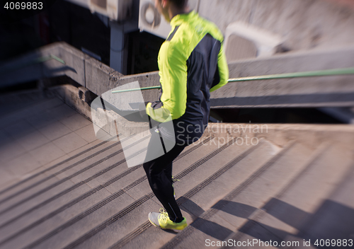 Image of man jogging on steps