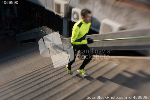 Image of man jogging on steps