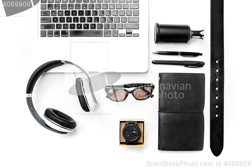 Image of Still life of casual man. Modern male accessories and laptop on white