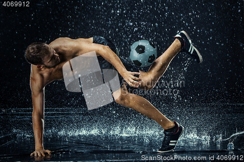 Image of Water drops around football player