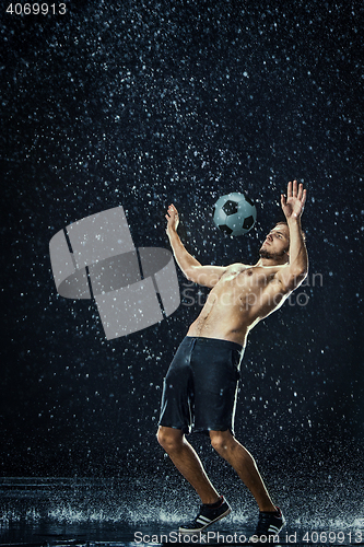 Image of Water drops around football player
