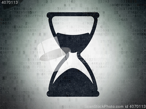 Image of Time concept: Hourglass on Digital Data Paper background