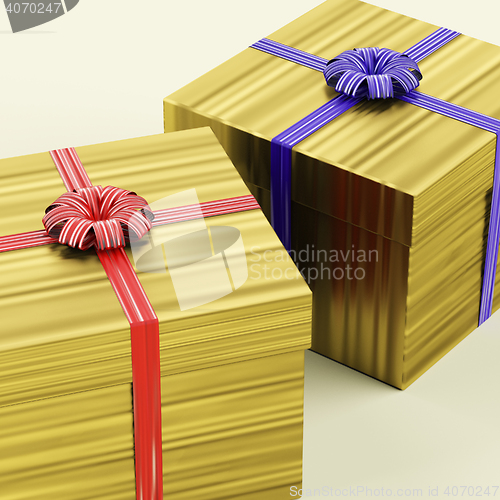 Image of Gold Gift Boxes With Ribbon As Birthday Present