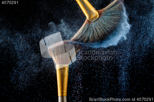 Image of Combination of powder and fluffy brushes for applying perfect make-up