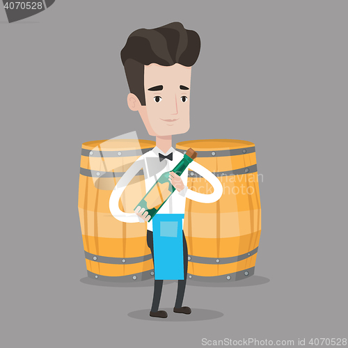 Image of Waiter holding bottle of alcohol.