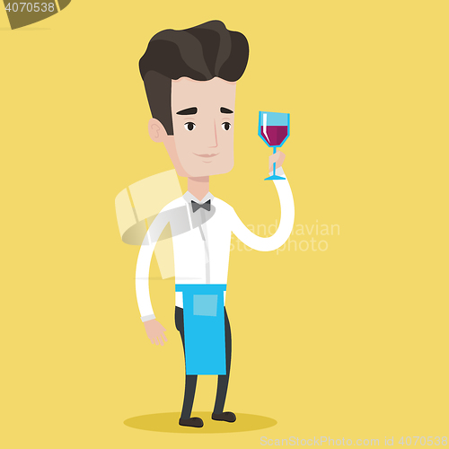 Image of Bartender holding a glass of wine in hand.