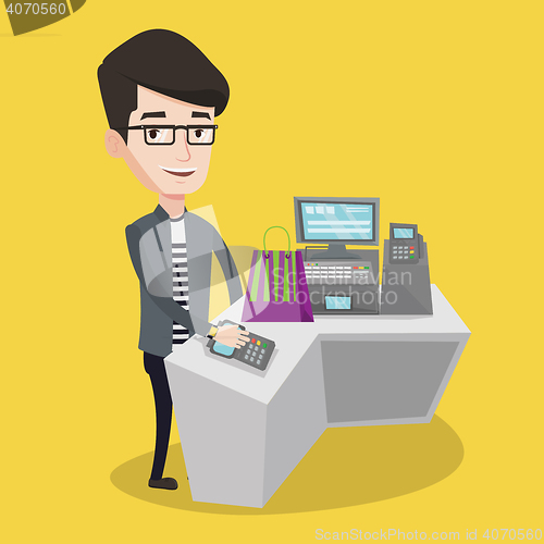 Image of Man paying wireless with smart watch.