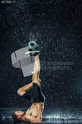 Image of Water drops around football player