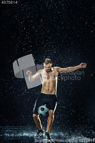 Image of Water drops around football player