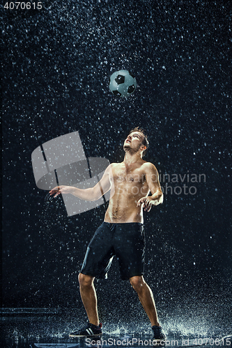 Image of Water drops around football player