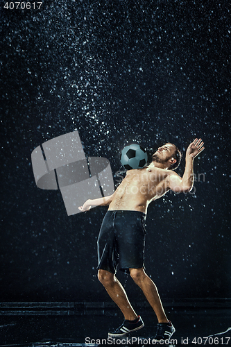 Image of Water drops around football player