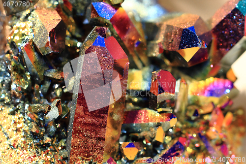 Image of crystal with metal rainbow surface