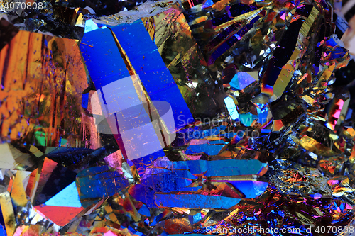 Image of crystal with metal rainbow surface
