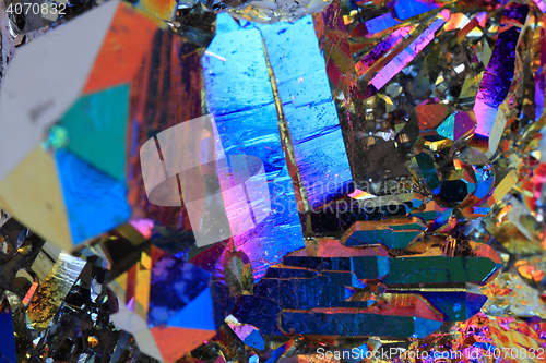 Image of crystal with metal rainbow surface