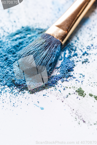 Image of Macro photo of eye shadow with brush on white background