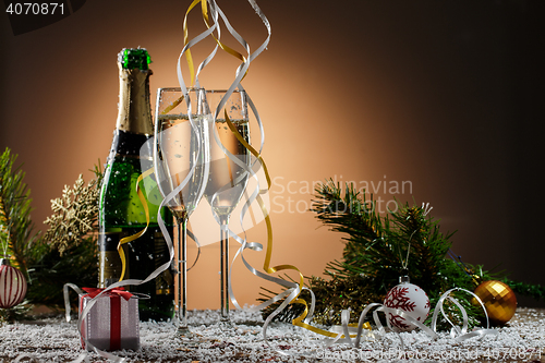 Image of Champagne glasses, Christmas balls, gift and other symbols of holiday