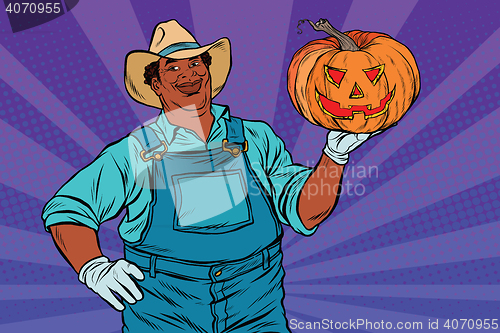 Image of African American farmer with a Halloween pumpkin