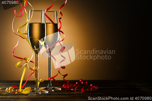 Image of Two glasses with champagne on festive table