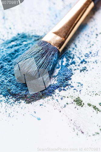 Image of Close-up eye shadow with brush on white background