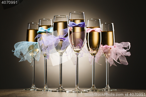 Image of Set of stylized glasses with champagne for wedding party