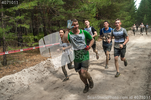 Image of Sportsmen run between stages in extrim race.Tyumen