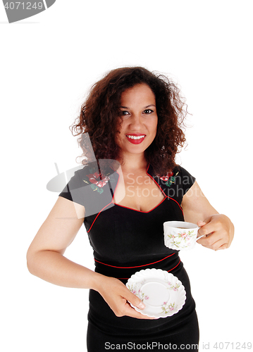 Image of Woman holding coffee cup.