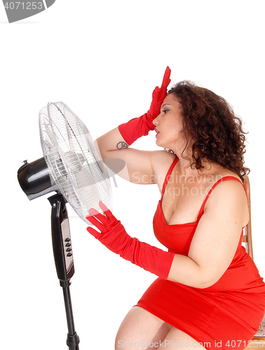 Image of Hot woman with big fan.