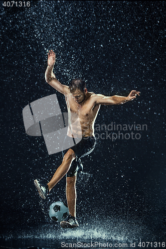 Image of Water drops around football player