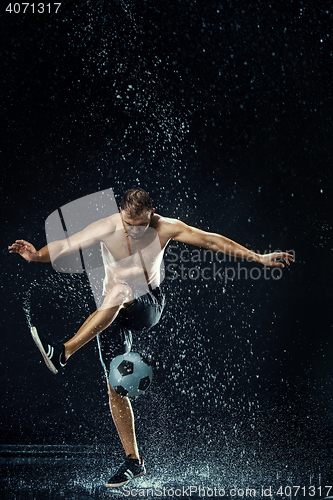 Image of Water drops around football player