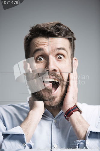 Image of Portrait of young man with shocked facial expression