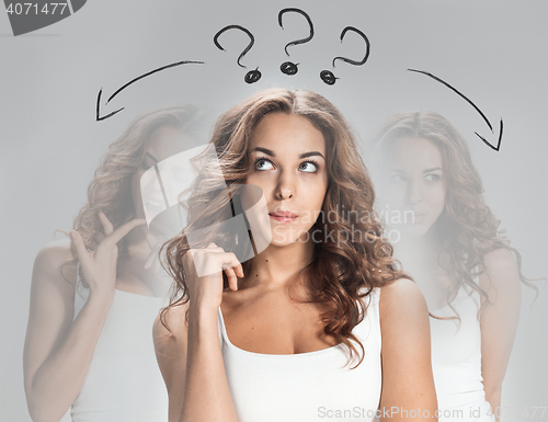 Image of The thoughtful woman on gray background