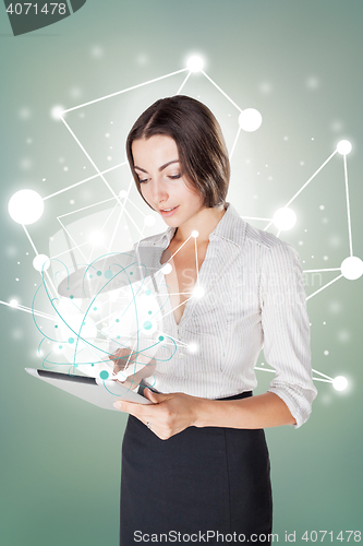 Image of Young business woman with laptop
