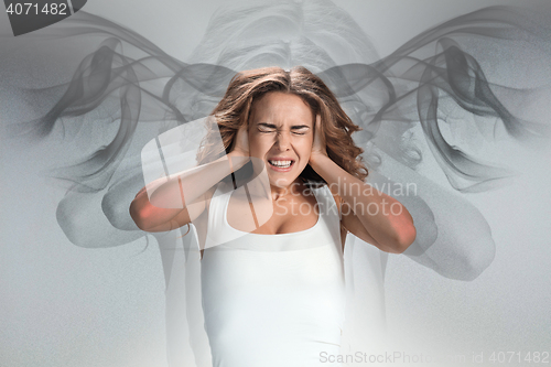 Image of The young woman\'s portrait with pain emotions