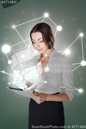Image of Young business woman with laptop