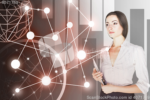 Image of Young business woman with laptop