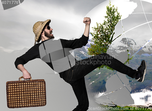 Image of man wtih suitcase ready to travel as tourist on gray background