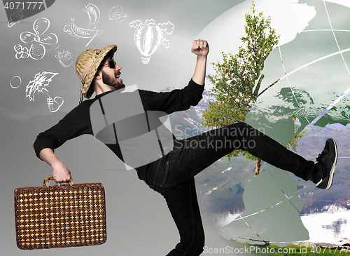 Image of man wtih suitcase ready to travel as tourist on gray background