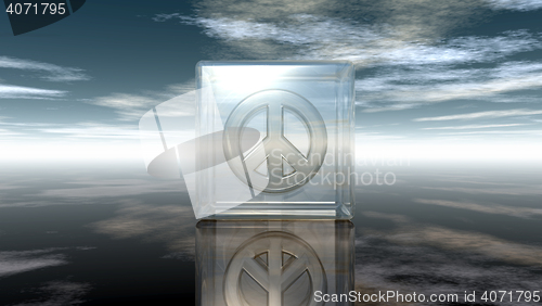 Image of pacific symbol in glass cube under cloudy sky - 3d rendering