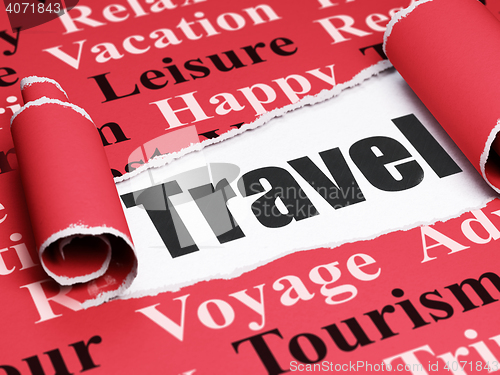 Image of Vacation concept: black text Travel under the piece of  torn paper