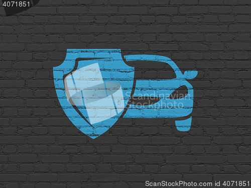 Image of Insurance concept: Car And Shield on wall background